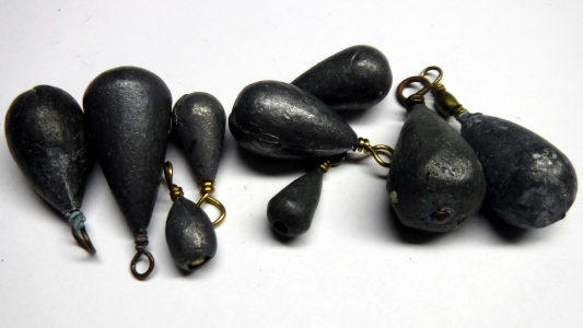 group shot of various bass casting sinkers