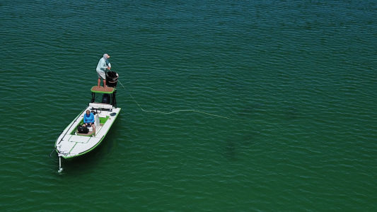 inshore fishing on a skiff in shallow water