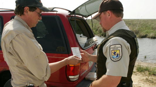 officer checking fishing license compliance