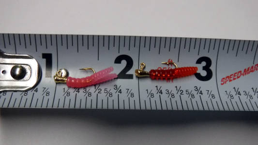pink and red mini trout magnet on a tape measure